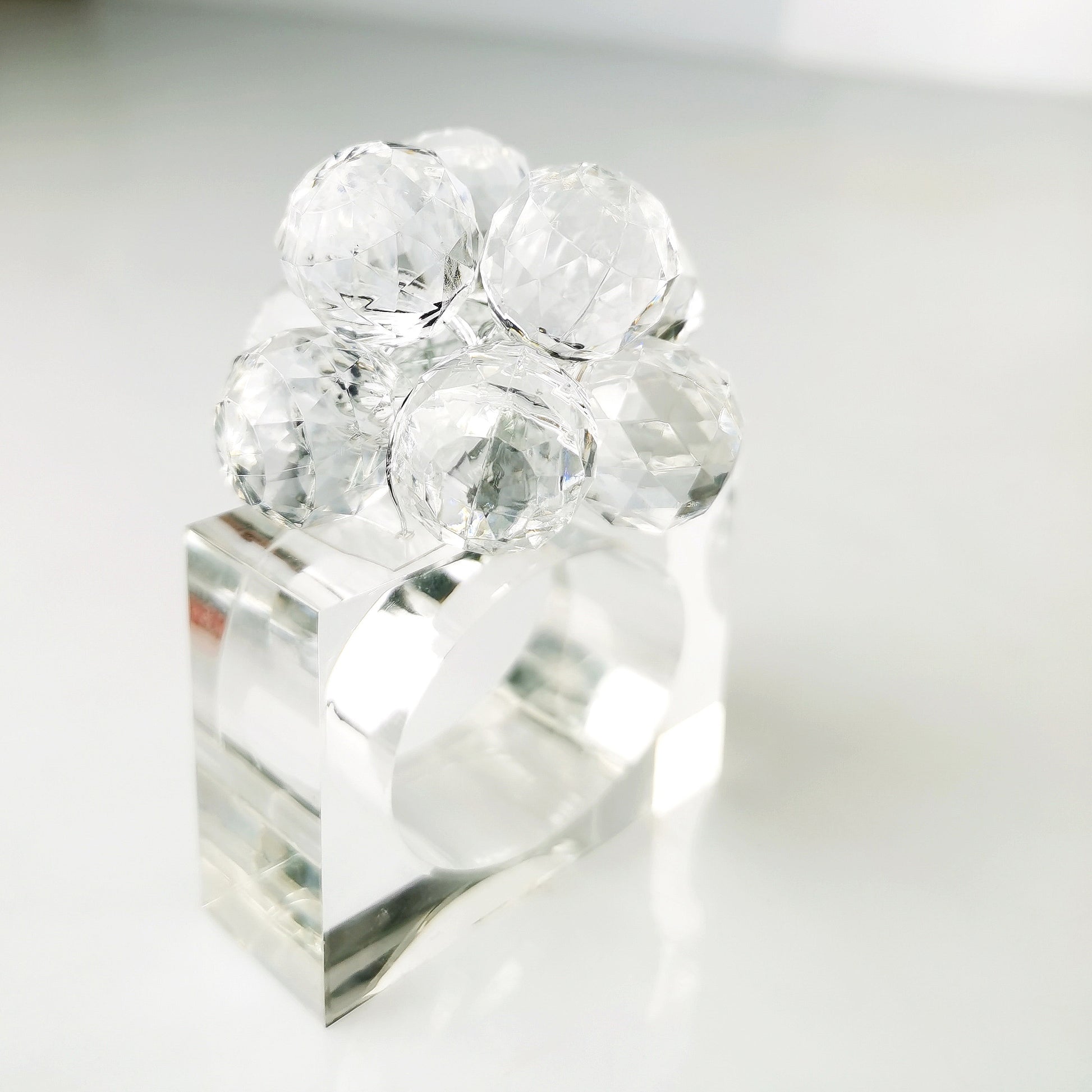 Clear crystal napkin ring on a white background
